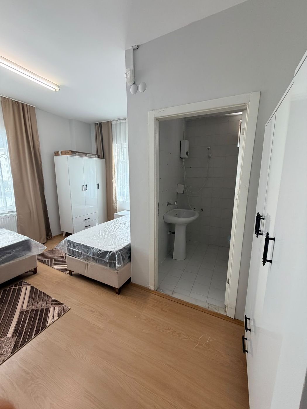 The shower and washbasin inside a room